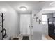 The entryway features neutral walls, tile flooring, coat rack, and a glimpse into the kitchen at 3310 Loveland Blvd # 1808, Punta Gorda, FL 33980