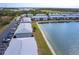 An aerial view of the condo buildings nestled next to a tranquil lake, with dedicated parking and scenic views at 3310 Loveland Blvd # 1808, Punta Gorda, FL 33980