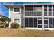 Well-maintained exterior features screened-in lanais on both levels for outdoor living and enjoyment at 3310 Loveland Blvd # 1808, Punta Gorda, FL 33980