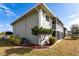 Exterior view of property with well-maintained lawn, shrubbery and landscaping at 3310 Loveland Blvd # 1808, Punta Gorda, FL 33980