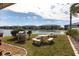 Outdoor grilling and picnic area by the lake, with lush green grass and comfortable seating at 3310 Loveland Blvd # 1808, Punta Gorda, FL 33980