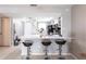 Open kitchen featuring a breakfast bar with seating and tile flooring at 3310 Loveland Blvd # 1808, Punta Gorda, FL 33980