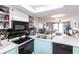 Open kitchen view with a double sink, appliances and easy access to the living room at 3310 Loveland Blvd # 1808, Punta Gorda, FL 33980