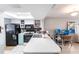 Bright kitchen with a breakfast bar, appliances, white cabinetry, and plenty of light at 3310 Loveland Blvd # 1808, Punta Gorda, FL 33980