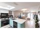 Bright kitchen and living room combination with tile flooring, modern appliances, and a cozy atmosphere at 3310 Loveland Blvd # 1808, Punta Gorda, FL 33980