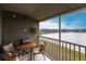 Screened patio with views of the lake and seating for relaxing at 3310 Loveland Blvd # 1808, Punta Gorda, FL 33980