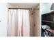 Shower with tile surround and shower head, a shelf for storage at 3310 Loveland Blvd # 1808, Punta Gorda, FL 33980