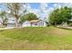 Charming home with a well-manicured lawn, complemented by a white exterior and a two-car garage at 3391 Rogue St, North Port, FL 34291