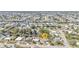 A high-angle shot showcases a waterfront neighborhood filled with canals and single-Gathering homes in a coastal community at 3627 Easy St, Port Charlotte, FL 33952
