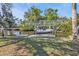 A boat lift on a canal with lush green trees and waterfront views at 3627 Easy St, Port Charlotte, FL 33952