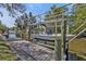Boat lift with a boat on a sunny day in a canal setting at 3627 Easy St, Port Charlotte, FL 33952