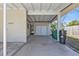 Carport showing the house number with a white brick exterior and attached storage at 3627 Easy St, Port Charlotte, FL 33952