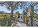 Long dock featuring a waterfront view with lush trees lining the canal's edge at 3627 Easy St, Port Charlotte, FL 33952