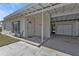 Inviting covered entrance with brick accents and a well-maintained walkway leading to the front door at 3627 Easy St, Port Charlotte, FL 33952