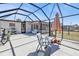 Wide screened patio area with ample seating and clear backyard views perfect for outdoor enjoyment at 3627 Easy St, Port Charlotte, FL 33952