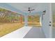 Covered outdoor patio area with a ceiling fan, perfect for enjoying the backyard view at 3700 Bobko Cir, North Port, FL 34291