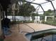 Private pool featuring clear water, a safety rail, and surrounded by a patio, perfect for relaxation at 3813 S Cranberry Blvd, North Port, FL 34286