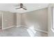 Minimalist bedroom with neutral walls, modern fan and plenty of natural light at 3841 Cinderella Rd, North Port, FL 34286