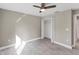 Neutral bedroom featuring a closet and a ceiling fan at 3841 Cinderella Rd, North Port, FL 34286