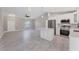 Open living area featuring modern kitchen, ceiling fan and lots of open space at 3841 Cinderella Rd, North Port, FL 34286