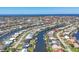 Aerial view showcases the canal-front homes of this waterfront community near the ocean at 430 Capri Isles Ct, Punta Gorda, FL 33950