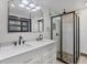 Sleek bathroom with double vanity, a walk-in shower, and contemporary fixtures at 430 Capri Isles Ct, Punta Gorda, FL 33950
