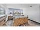 Cozy bedroom featuring a wooden bed frame, side tables with lamps, and a soothing color scheme at 430 Capri Isles Ct, Punta Gorda, FL 33950