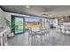 Well-lit dining room with canal views, featuring a stylish table set and access to outdoor spaces at 430 Capri Isles Ct, Punta Gorda, FL 33950