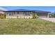 Charming single-story home with a well-manicured lawn and updated roofing at 430 Capri Isles Ct, Punta Gorda, FL 33950