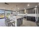 Modern kitchen featuring a large island, stainless steel appliances, and stylish finishes at 430 Capri Isles Ct, Punta Gorda, FL 33950