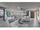 Spacious living room flowing into an open floor plan with dining and kitchen areas at 430 Capri Isles Ct, Punta Gorda, FL 33950