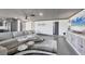 Inviting living room featuring a stylish ceiling, cozy seating, and modern decor at 430 Capri Isles Ct, Punta Gorda, FL 33950