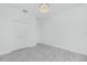 Spacious and bright bedroom with a ceiling light, light colored tile flooring, and a double door closet at 4818 Kiska Rd, North Port, FL 34288