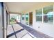 Covered patio with brick flooring, offering an ideal space for outdoor relaxation and entertaining at 565 Mistiflower Cir, Nokomis, FL 34275