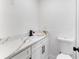 Bathroom featuring a marble-look vanity, white cabinets, and a sleek black faucet at 6534 29Th N Way, St Petersburg, FL 33702