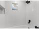 Bathroom with modern walk-in shower featuring an over-sized shower head and recessed shelf at 6534 29Th N Way, St Petersburg, FL 33702
