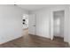 Bright bedroom with an open closet and view of the home's modern kitchen at 6534 29Th N Way, St Petersburg, FL 33702