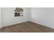 Minimalist bedroom with natural light, featuring hardwood floors and modern decor at 6534 29Th N Way, St Petersburg, FL 33702