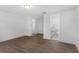 Clean bedroom with wood-look flooring, neutral walls, a closet, and an ensuite bathroom at 6534 29Th N Way, St Petersburg, FL 33702