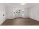 Bright living room with wood-look flooring, neutral walls, and a bay window at 6534 29Th N Way, St Petersburg, FL 33702