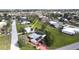 Aerial view showcasing the property within a well-maintained neighborhood with mature trees and green spaces at 7534 Carissa, Punta Gorda, FL 33955