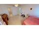 Large bedroom featuring tile flooring and access to an en-suite bathroom at 7534 Carissa, Punta Gorda, FL 33955