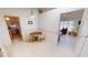 The eat-in kitchen features tile flooring, white cabinetry, and is adjacent to the living room at 7534 Carissa, Punta Gorda, FL 33955