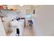 Bright laundry room with Washer and dryer, sink, shelving, and lots of storage space at 7534 Carissa, Punta Gorda, FL 33955