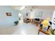 Inviting living room with neutral tile floors, a skylight, and plenty of natural light at 7534 Carissa, Punta Gorda, FL 33955