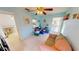 Light blue living room featuring tile floors, a ceiling fan, and a sofa at 7534 Carissa, Punta Gorda, FL 33955