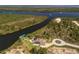 Aerial view of a stunning waterfront home with private dock and bay access at 9149 Lane Ct, Port Charlotte, FL 33981