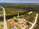 Stunning aerial view of waterfront home featuring solar panels and a private dock at 9149 Lane Ct, Port Charlotte, FL 33981