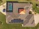 Drone shot capturing the pool, solar panels, and unique architecture of the home at 9149 Lane Ct, Port Charlotte, FL 33981