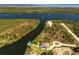 Waterfront home with a private dock nestled along a scenic river and lush landscapes at 9149 Lane Ct, Port Charlotte, FL 33981